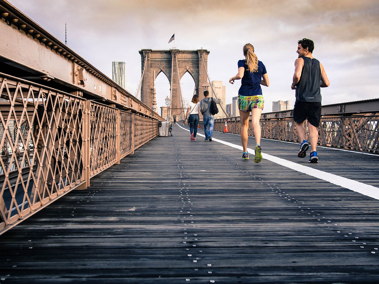 exercise is good for depression, picture of people running on a bridge